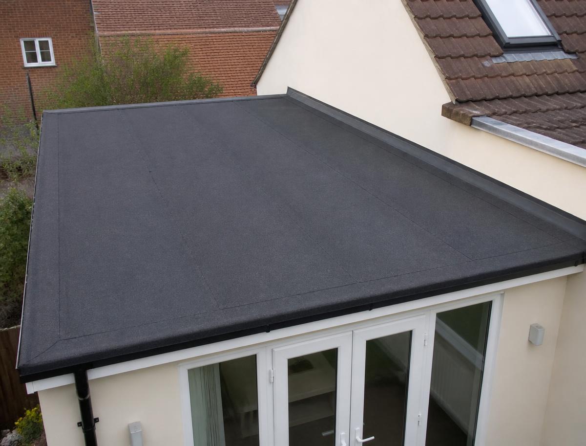 New flat roof membrane installed on a house extension